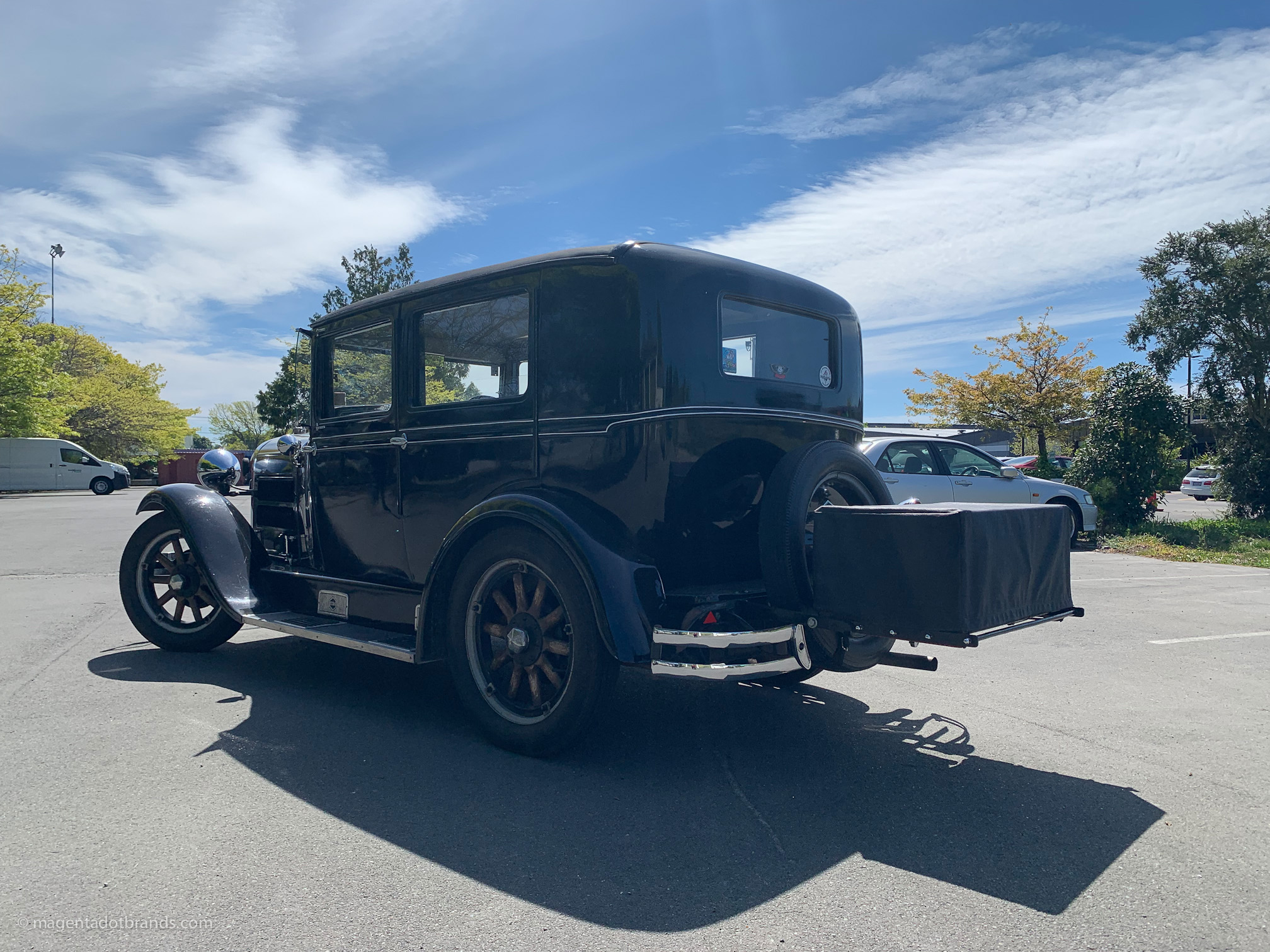 Left hand side rear three-quarter view of a restored 1928 Essex Super Six with a touring box mounted on the back