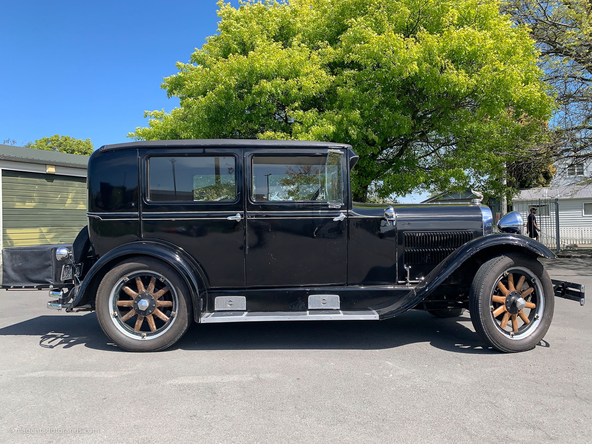 Right hand side profile of a restored 1928 Essex Super Six in the mid day sun
