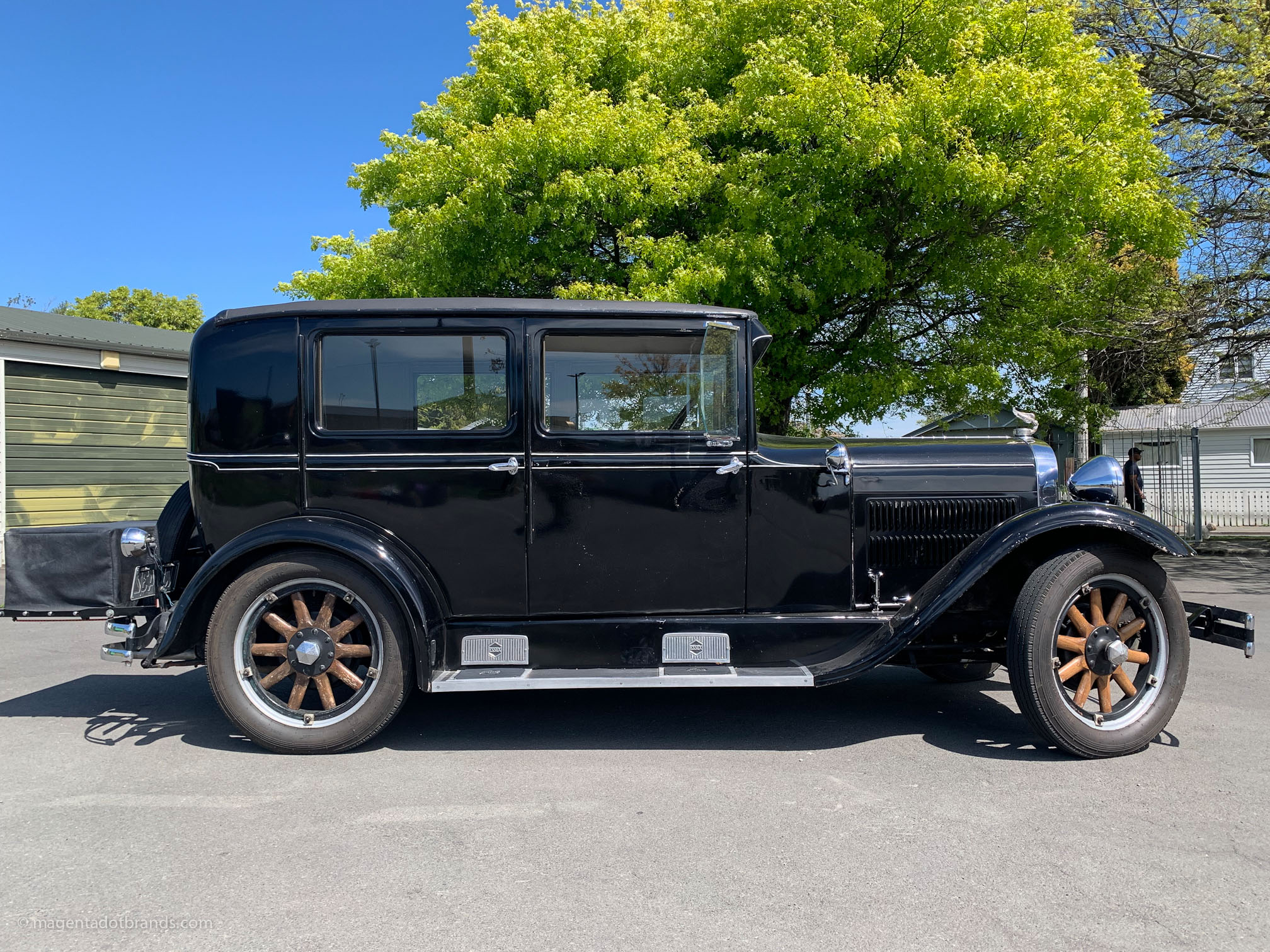 Right hand side profile of a restored 1928 Essex Super Six in the mid day sun