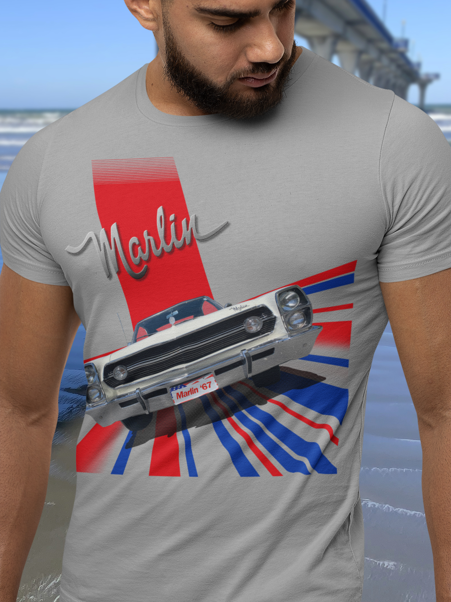 Bearded man in grey marle t-shirt showcasing a 1967 AMC Marlin 'Grand Prix' print with a faded top edge.
