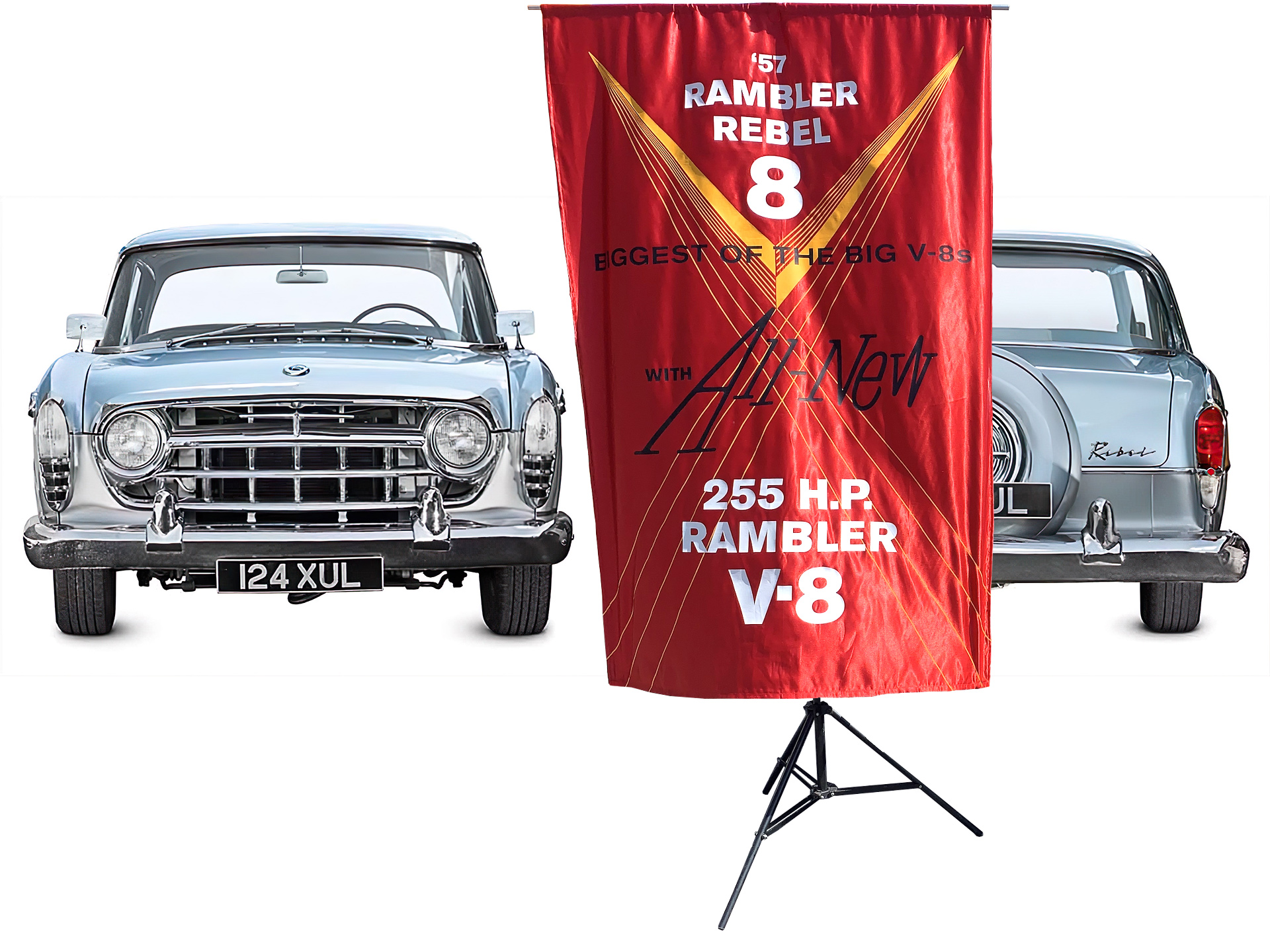 1957 Rambler Rebel sedan in front and rear views, clear-cut on a white background, with a re-created red silk dealership banner in front of them.