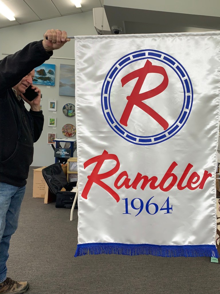 Finished 1964 Rambler banner in red, white, and blue, showcasing a recreated classic design.